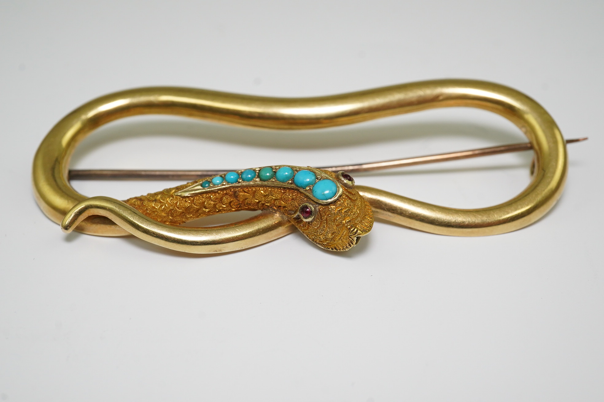 A Victorian gold, turquoise and cabochon gem set open work serpent brooch